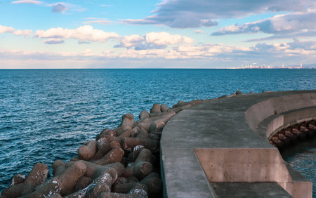 View from an old breakwater with tetrapodsの写真素材