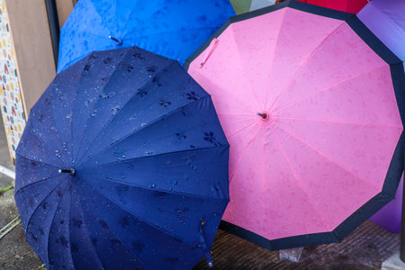 Close-Up of Wet Umbrellas After Rainfall in Cityの写真素材