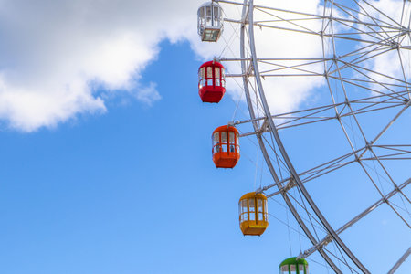 Colourful ferris wheel against a blue sky, Japanの写真素材