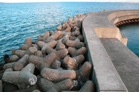 View from an old breakwater with tetrapodsの写真素材