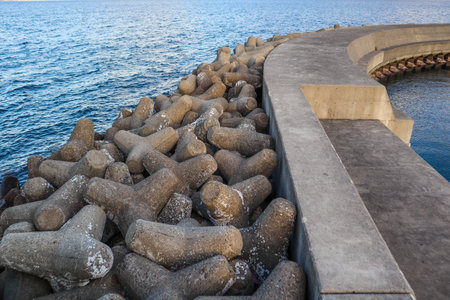 View from an old breakwater with tetrapodsの写真素材