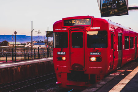 Commuter Train Waiting at a Japanese Railway Platformの写真素材