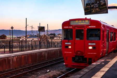 Commuter Train Waiting at a Japanese Railway Platformの写真素材