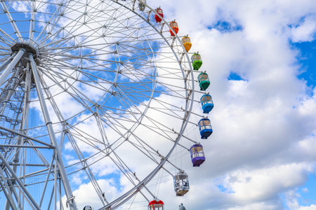colourful ferris wheel against a blue sky, Japanの写真素材