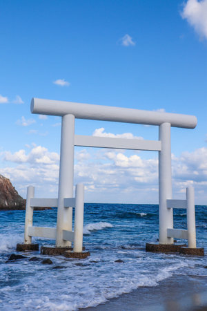 Sacred Shinto Shrine Gate by the Sea with Wedded Rocks, Fukuoka Japanの写真素材