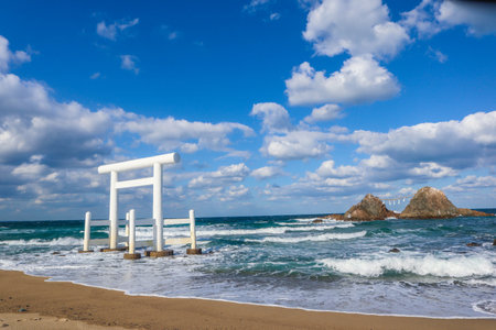 Sacred Shinto Shrine Gate by the Sea with Wedded Rocks, Fukuoka Japanの写真素材