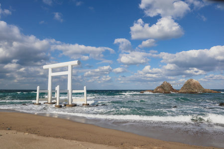 Sacred Shinto Shrine Gate by the Sea with Wedded Rocks, Fukuoka Japanの写真素材