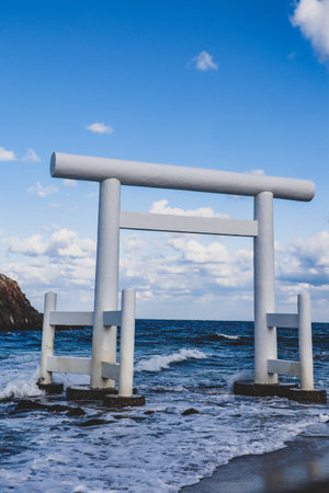 Sacred Shinto Shrine Gate by the Sea with Wedded Rocks, Fukuoka Japanの写真素材