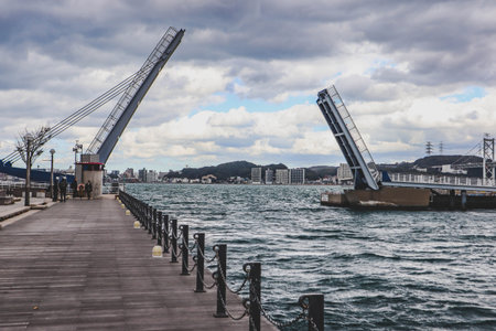 Modern Bascule Bridge Lifting over Waterfront in Kitakyushu, Japanの写真素材