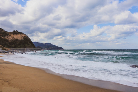 Stormy Ocean View with Rough Waves and Overcast Sky along Japanese Coastline