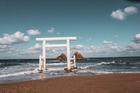 Sacred Shinto Shrine Gate by the Sea with Wedded Rocks, Fukuoka Japanの写真素材