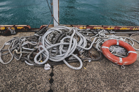 arine Ropes and Life Ring on Pier â€“ Harbor Detail for Boating and Rescue Theme