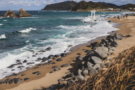 Sacred Shinto Shrine Torii on Rocky Coastline of Southern Japan.の写真素材