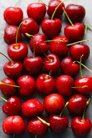 Photos from above, fresh fruit cherries covered, drops of water covered.