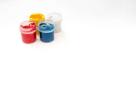 Watercolor paint in buckets isolated on white background. Art palette. Colorful paint. Gouache in the jar.の写真素材