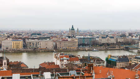 Scenic view of Pest side with St. Stephen's Basilica in center and Danube river in Budapest Hungary with haze on the horizon after the rainの写真素材