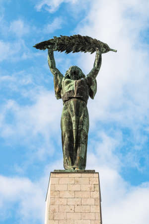 Liberty Statue against the blue sky at sunny dayの写真素材