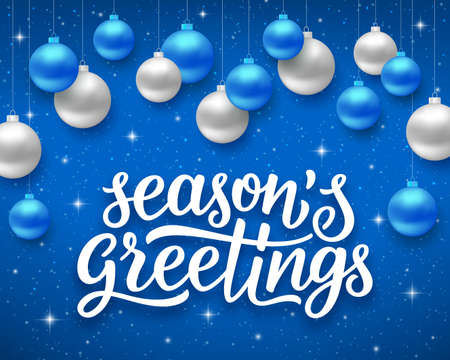 Seasons greetings script text on blue background with sparkles and colorful hanging balls. Vector illustration for holidays with letteringのイラスト素材