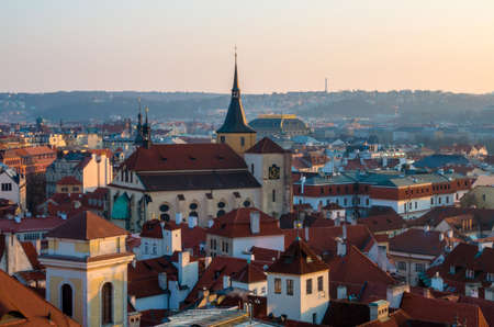 Sunset in Prague, Czech Republic. Aerial view at the scenic cityscape with red roofs of old townの写真素材