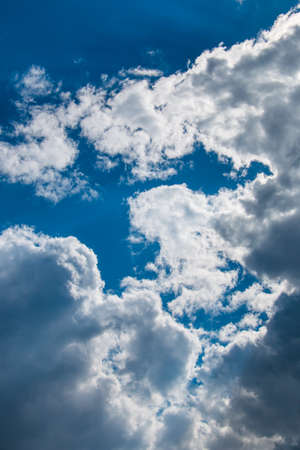 Scenic view at blue sky with clouds. Abstract nature background. Dramatic sky with fluffy clouds. Sunny day.の写真素材