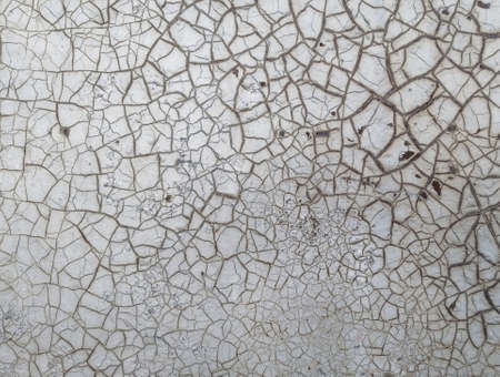 Old cracked paint texture on the wall. Close-up of vintage damaged surface