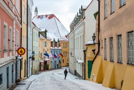 Tallinn, Estonia - March 12, 2019: Beautiful street in the old town with colorful houses and walking people in winter timeのeditorial素材