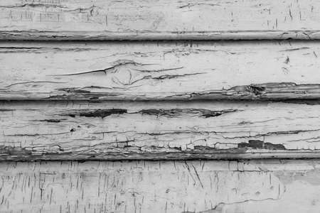 Wood texture close-up photo. Vintage wooden wall background. White cracked paint plank panelsの写真素材