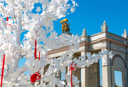 Moscow, Russia - April 30, 2019: Main entrance to VDNH exhibition and city park with easter decorations of the street. Tourist place with historical USSR monuments and soviet architectureのeditorial素材