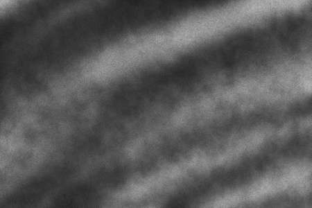 Subtle noise texture. Gritty grunge background with black paint spots isolated on white paperの写真素材