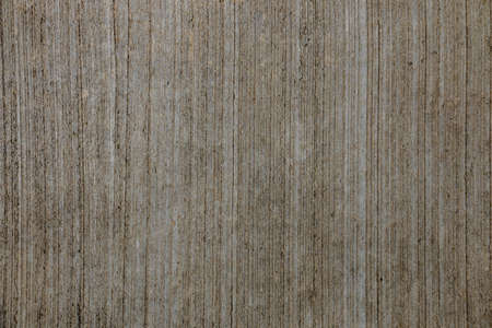 Brown concrete floor texture with small dash pattern. Close-up of speckled grunge background