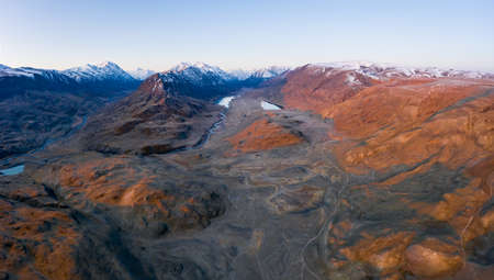 Beltirdu Mountain Ridge. Green Hills, Lakes and River in Autumn at Sunrise. Aerial View....