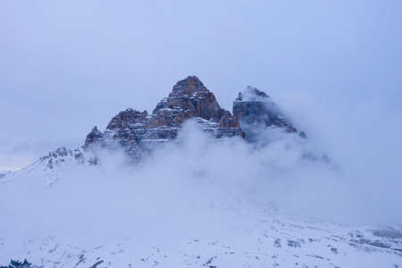 Tre Cime Di Lavaredo. The Three Peaks on Winter Day and Clouds. Aerial View. Sexten Dolomites, South Tyrol. Italy. View from the South.の写真素材