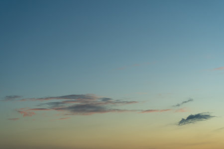 Sky with Colorful Pink and Dark Cirrus Clouds at Sunset. Abstract Texture Background Pattern.の写真素材