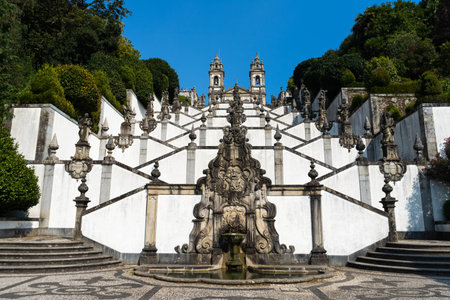 Sanctuary of Bom Jesus do Monte on Sunny Day. Stairway and Church. Green Trees. Braga, Portugalの写真素材
