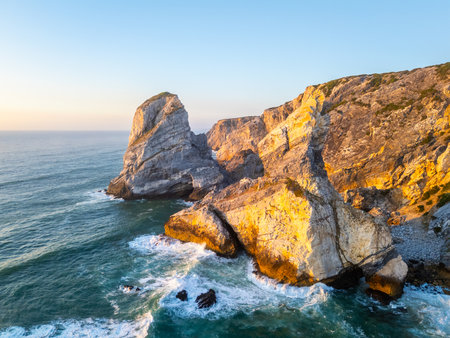 Cliffs near Ursa Beach, Sea Stacks, Atlantic Ocean Waves at Sunset. Portugal. Golden Hour. Aerial Drone Shotの写真素材