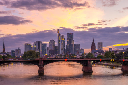 Frankfurt City Downtown at Sunset and Main River. View from Floserbrucke Bridge. Hesse, Germany