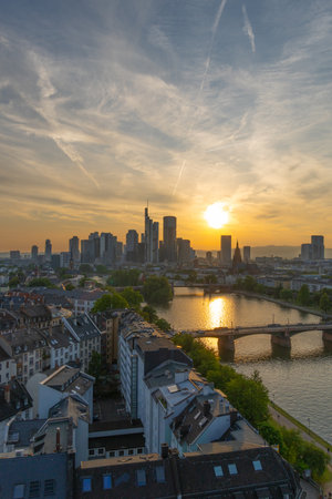 Frankfurt City Skyline, Residential Buildings, Bridges and Main River at Sunset. Wide Shot. Aerial View. Golden Hour. Hesse, Germanyの写真素材