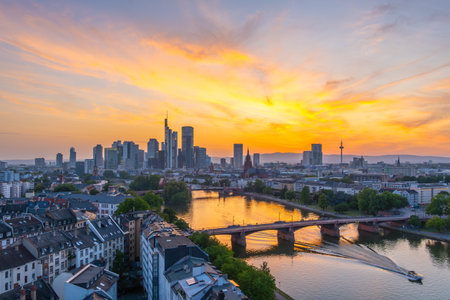 Frankfurt City Downtown, Residential Buildings, Bridges and Main River at Fiery Colorful Sunset. Wide Shot. Aerial View. Golden Hour. Hesse, Germanyの写真素材