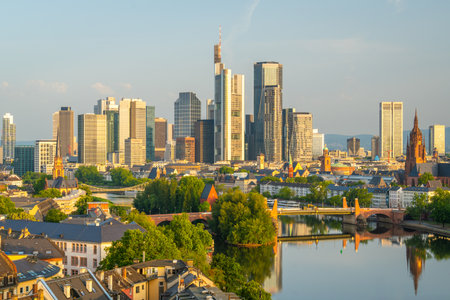 Frankfurt City Skyline, Residential Buildings, Bridges and Main River on Sunny Morning. Aerial View. Golden Hour. Hesse, Germanyの写真素材