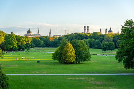 Englischer Garten Green Public Park and City Skyline on Summer Evening. Munich, Bavaria, Germanyの写真素材