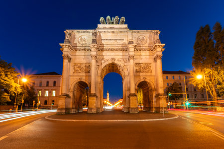Famous Siegestor Memorial Arch at Night and Car Light Trails. Munich, Bavaria, Germanyの写真素材