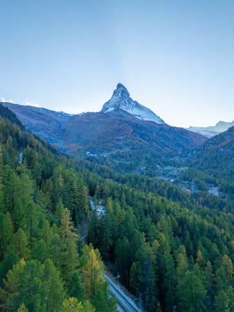 Matterhorn Mountain and Green Larches in Autumn in Evening. Aerial View. Swiss Alps. Zermatt, Valais, Switzerland. Wide Shotの写真素材