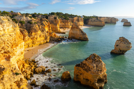 Marinha Beach, Sea Stacks, Cliffs and Atlantic Ocean on Sunny Day. Algarve, Portugalの写真素材