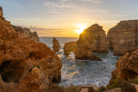 Ponta da Piedade Arches, Rock Formations, Cliffs and Atlantic Ocean at Sunrise. Algarve, Portugalの写真素材