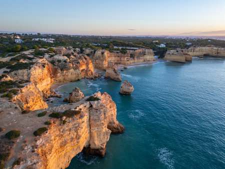 Marinha Beach, Cliffs and Atlantic Ocean at Sunrise. Green Trees. Aerial View. Algarve, Portugalの写真素材