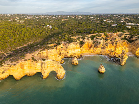 Marinha Beach, Arch, Sea Stacks, Cliffs and Atlantic Ocean on Sunny Day. Drone Shot. Algarve, Portugalの写真素材