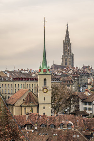 Cityscape of Bern Old Town on Cloudy Day. Berner Munster Cathedral. Switzerland