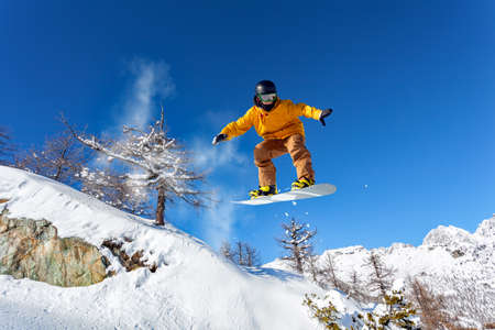 jump with snowboard in fresh snowの写真素材