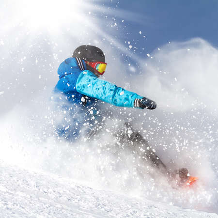 downhill with snowboards in fresh snowの写真素材