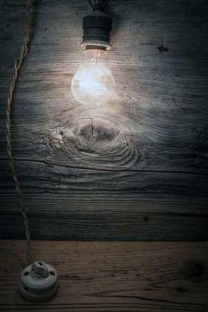 old ceramic switch with light bulbの写真素材